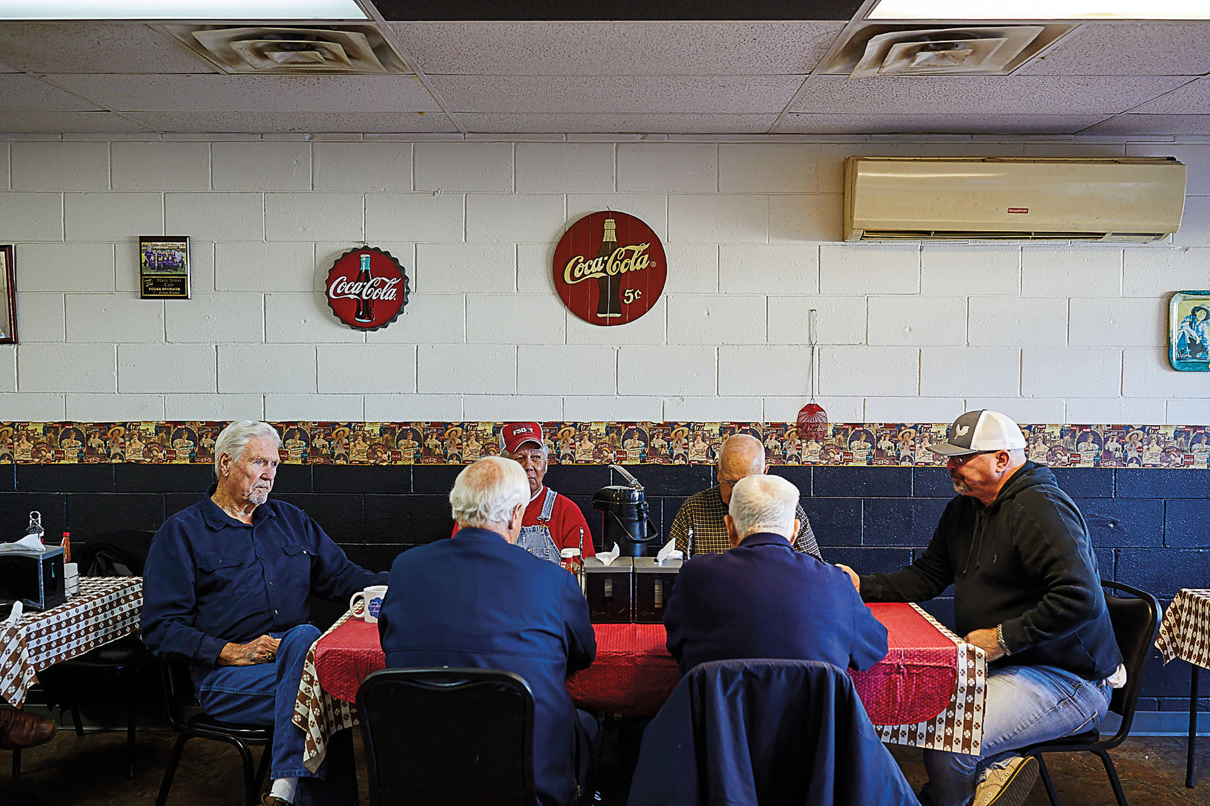 A group of men dine at the Main Street Cafe in Carthage Texas