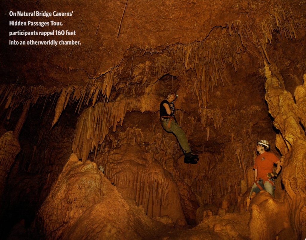 Two men rappeling in the Natural Bridge Caverns