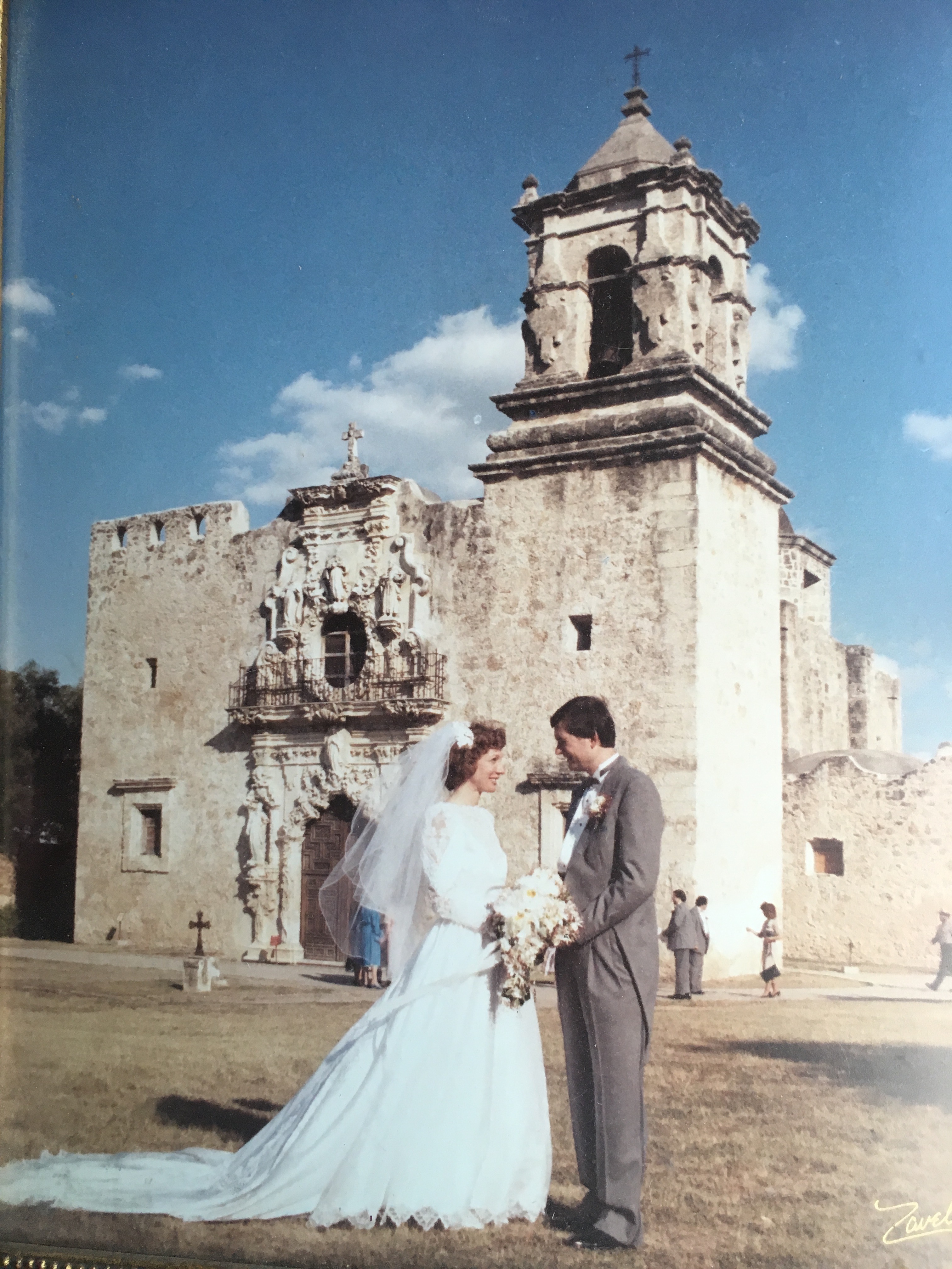 Annette Bernhard Nevins and her husband on their wedding day in front of Mission San José.