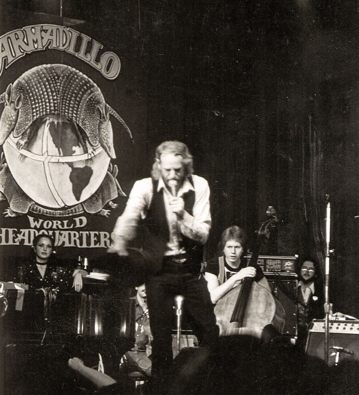 A black and white picture of Asleep At The Wheel performing at Armadillo World Headquarters