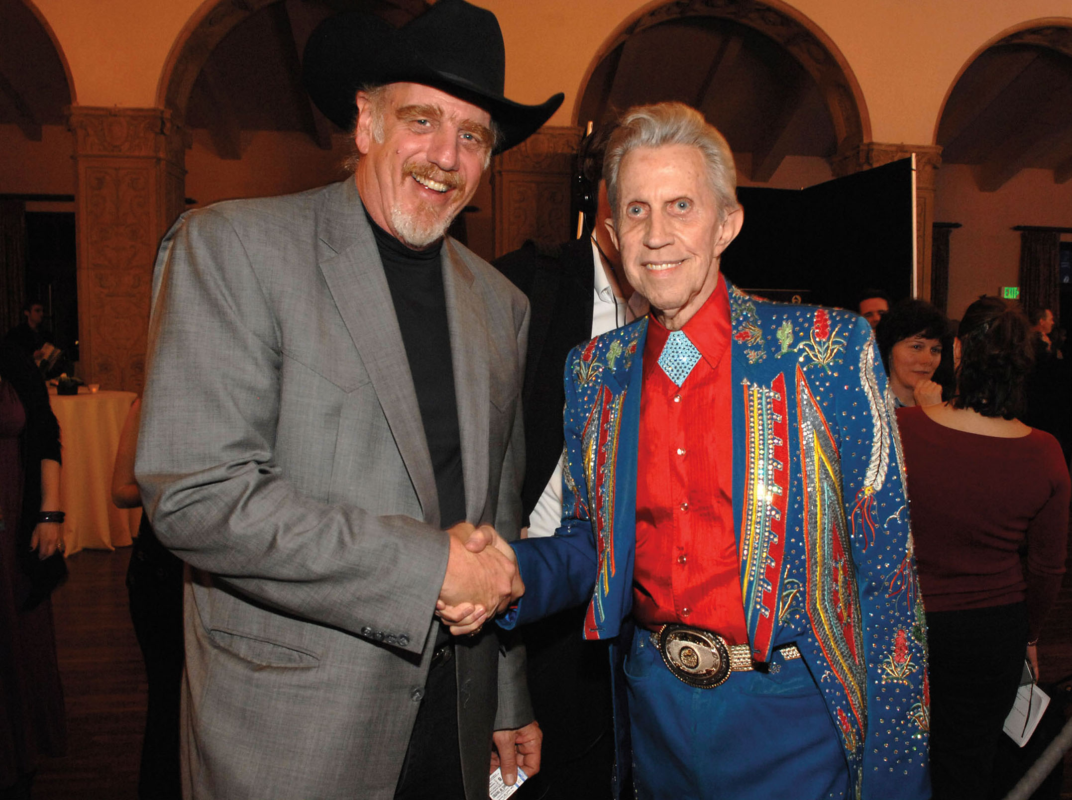 Ray Benson shakes hands with Porter Wagoner