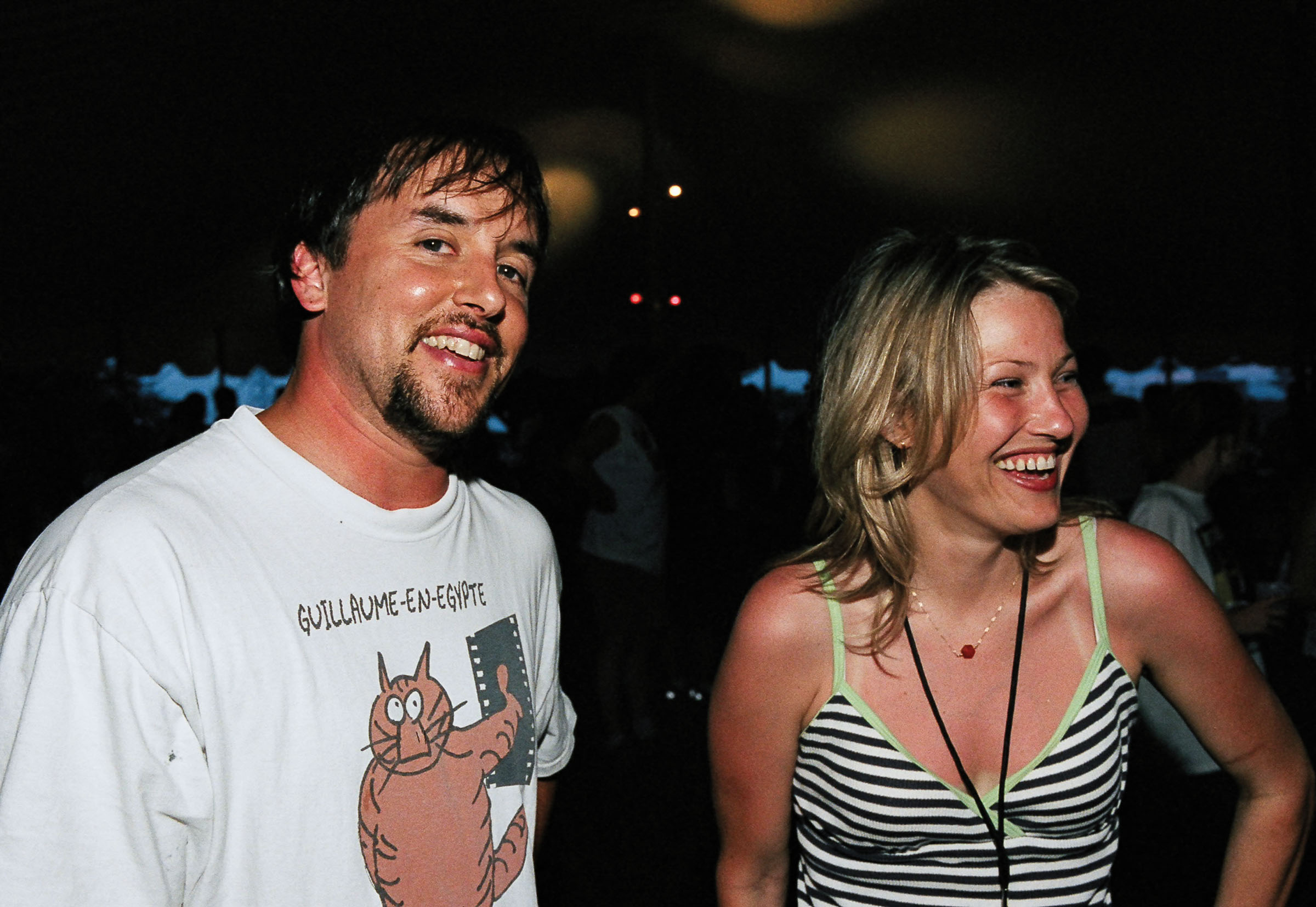 Linklater stands and laughs next to Joey Lauren Adams