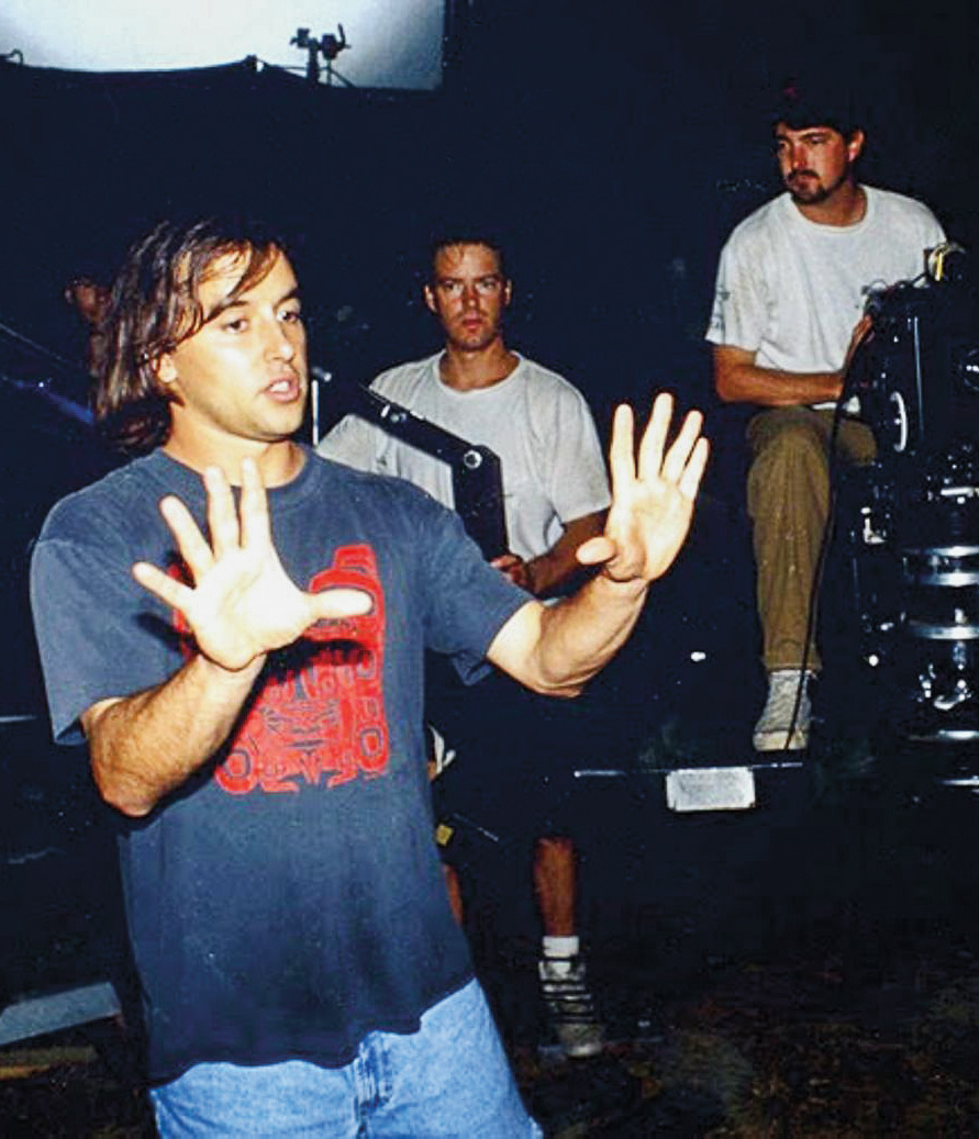 Linklater holds his hands up in front of him as he talks to the crew of Dazed and Confused