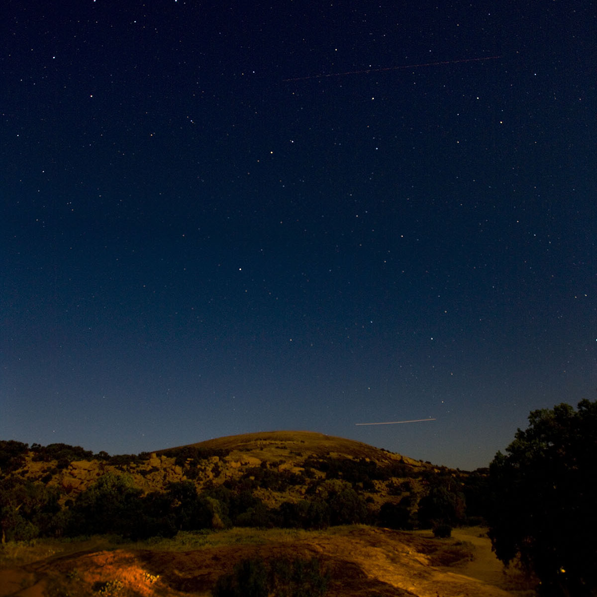 The night sky above the rugged red-brown of enchanted rock
