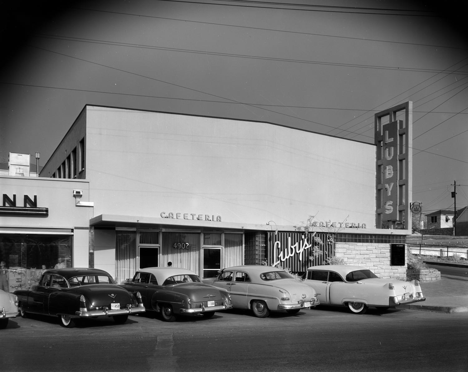 black and white, luby's cafeteria, exterior, vintage cars, signage