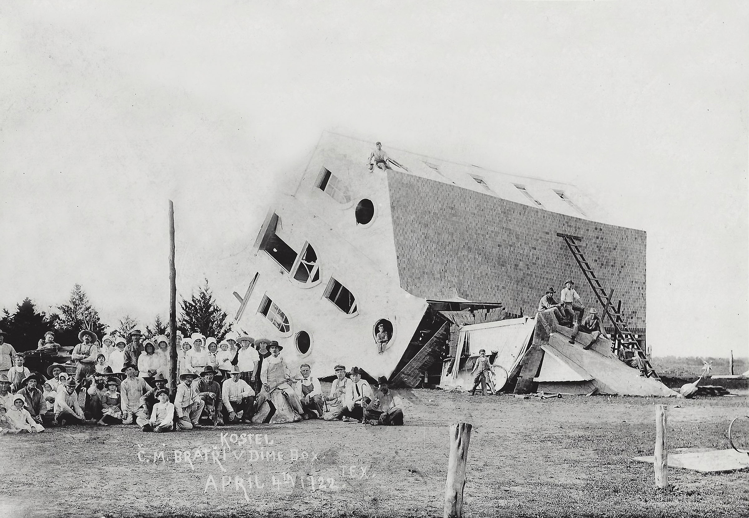 A church toppled on its side by a tornado