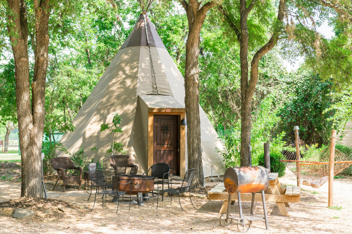 One of the eight tipis with a hammock and barbecue cooker at Tipis on the Guadalupe. Photo courtesy River Road Vacation Rentals. 