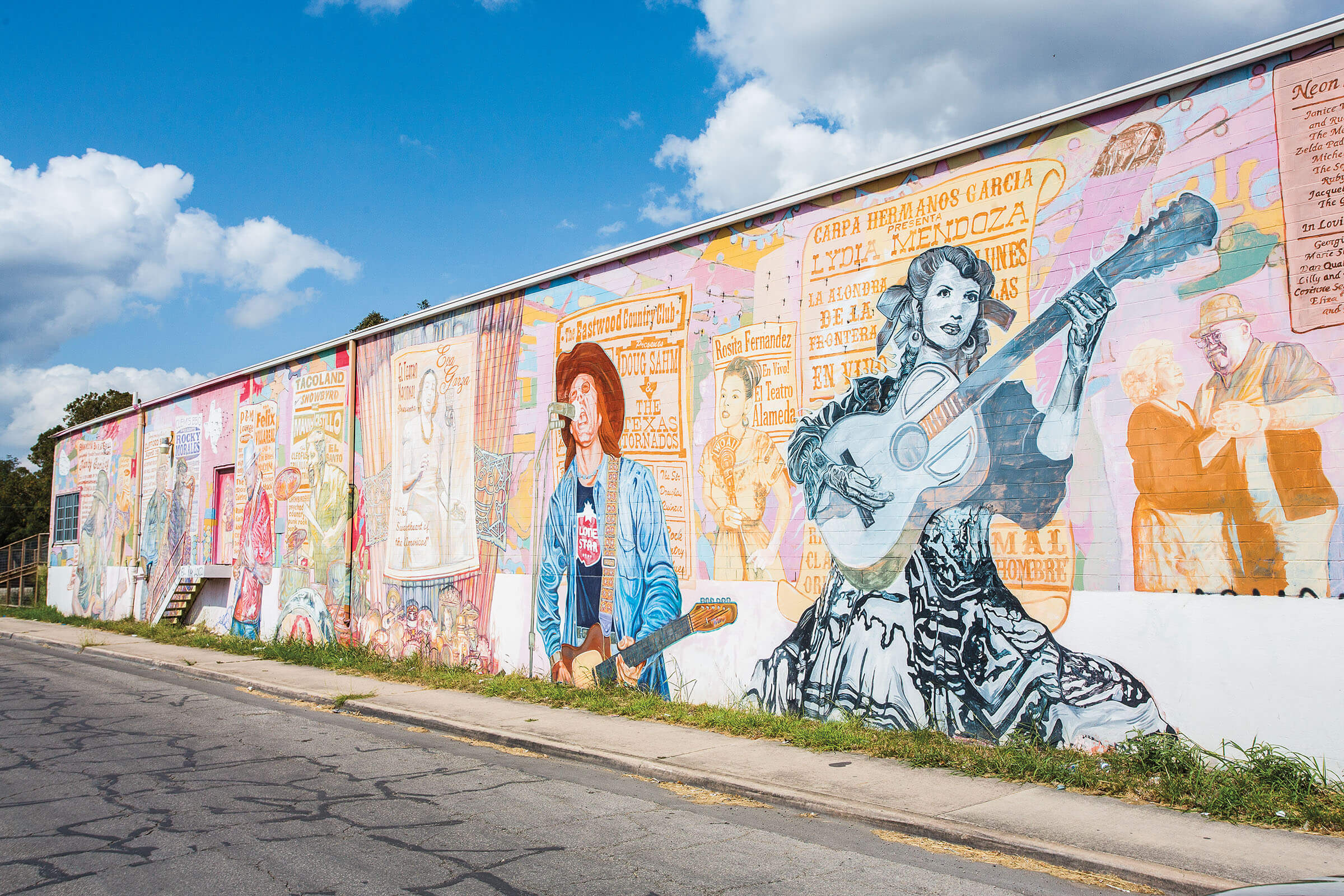 A mural showing several famous Westside artists in San Antonio