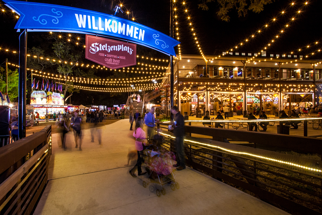 String lights and a banner reading ‘Willkommen’ welcome guests walking into Wurstfest
