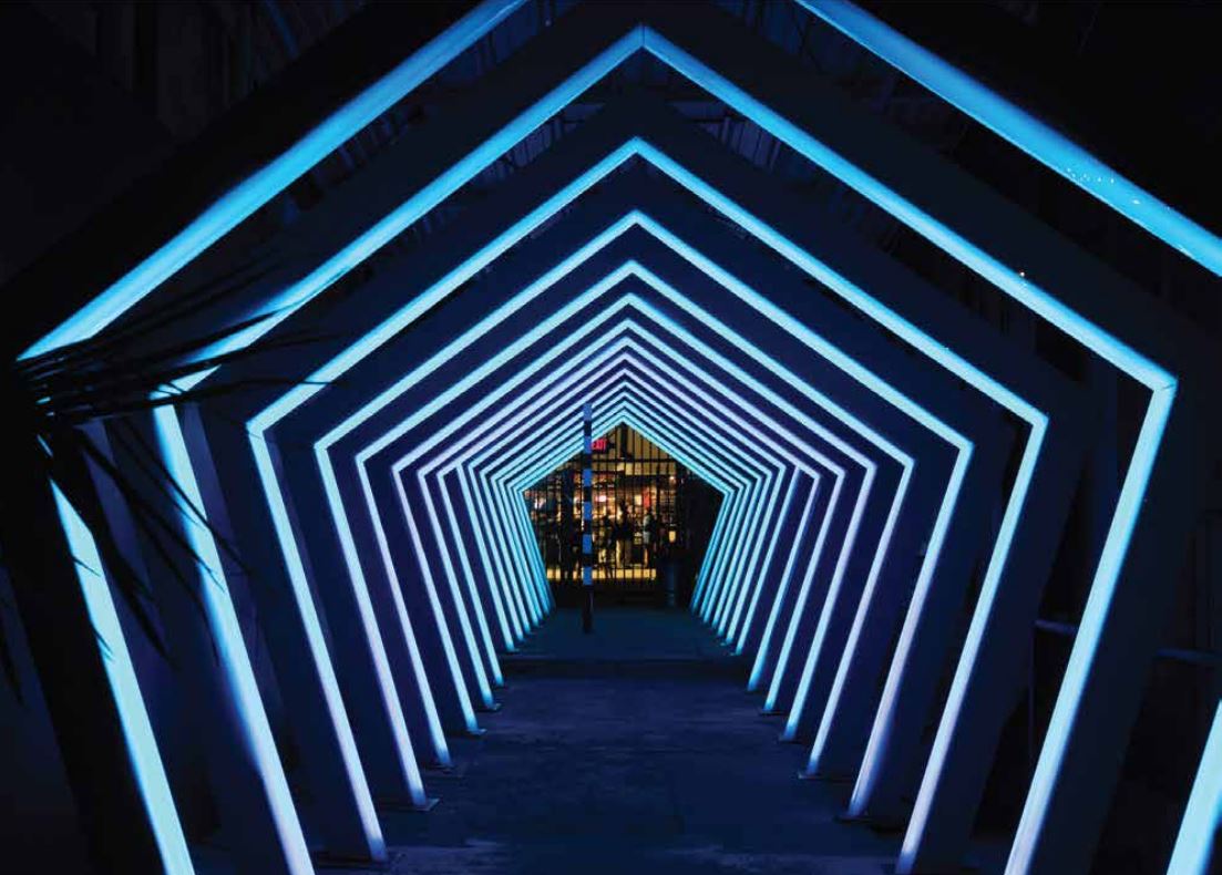 A tunnel created by blue light fixtures at the Bee Cave Buzzfest. Photo courtesy Bee Caves Arts Foundation