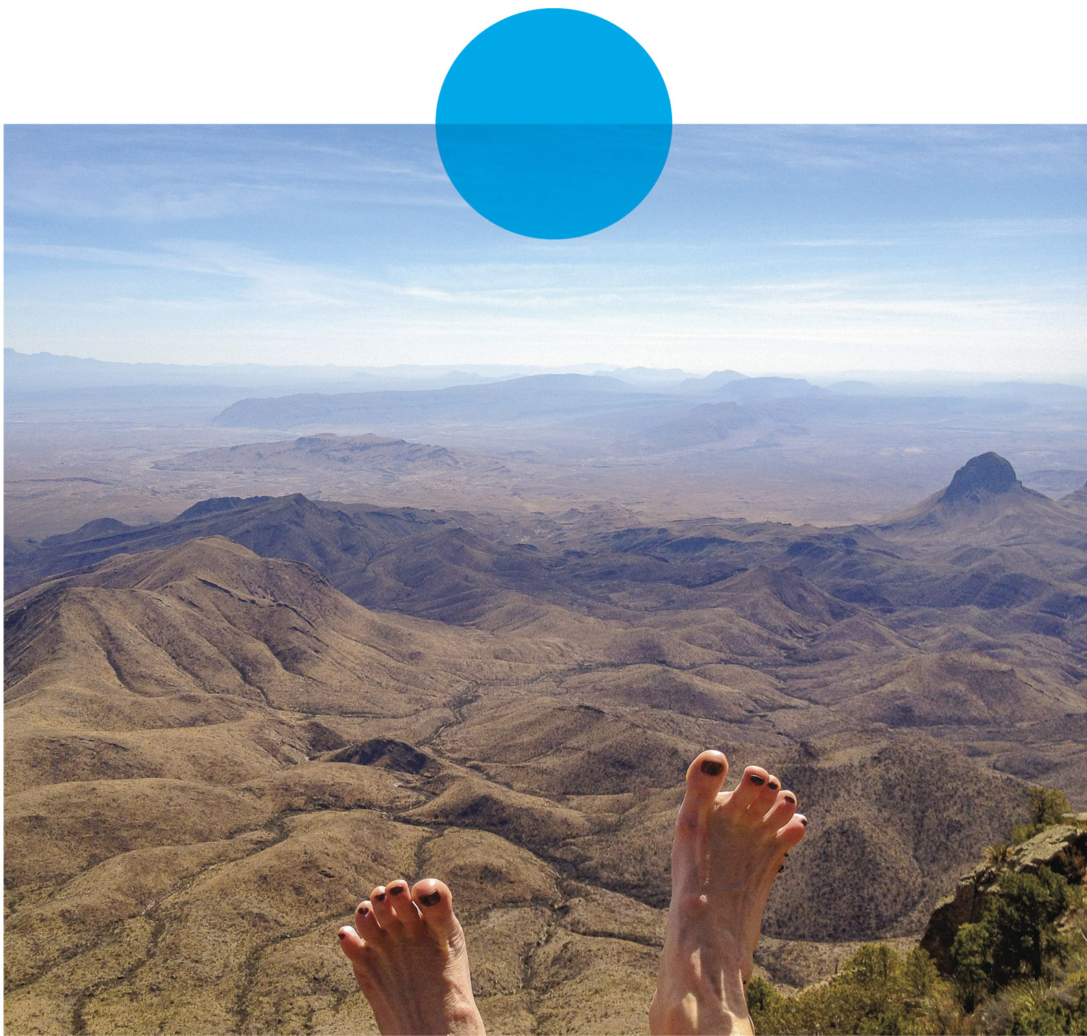 A pair of bare feet overlooking the South Rim of the Chisos Mountains