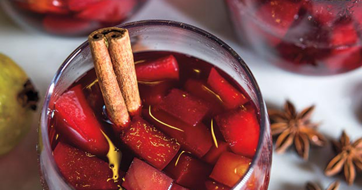christmas punch in a glass with cinnamon sticks