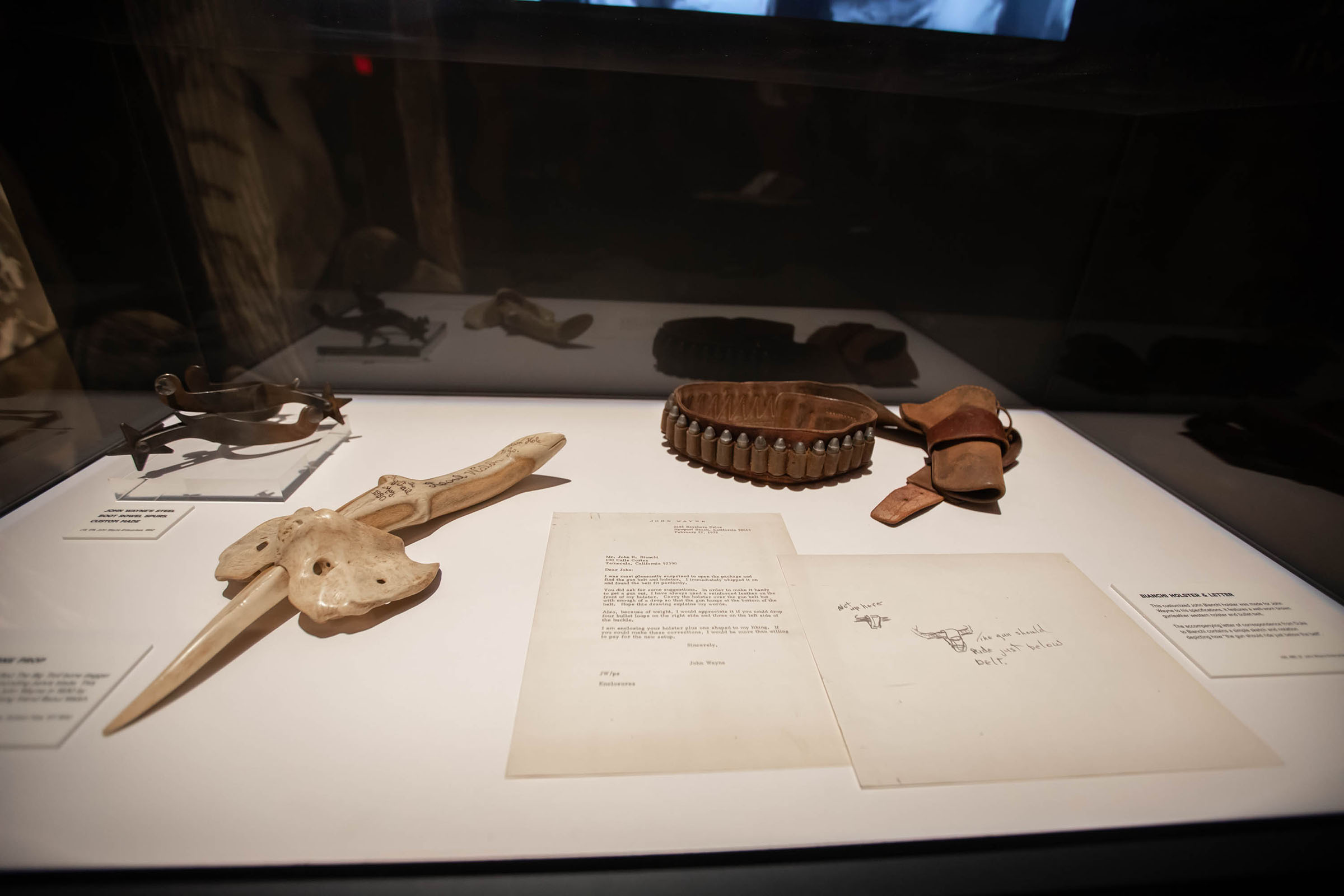 Among a group of props in a display case is the bone knife and sheath gifted to John Wayne from director Raoul Walsh. Photo courtesy John Wayne Enterprises.