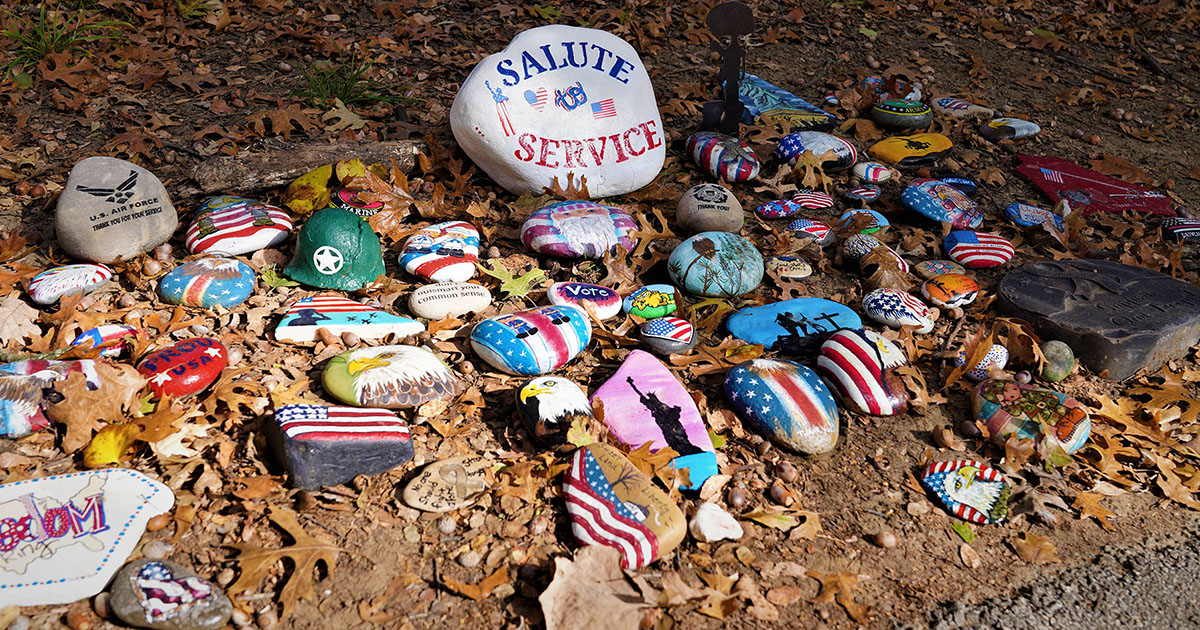 A colorful display of some of the patriotic rocks painted and lining the trail in Parr Park in Grapevine. Photo courtesy of Ron Olsen.
