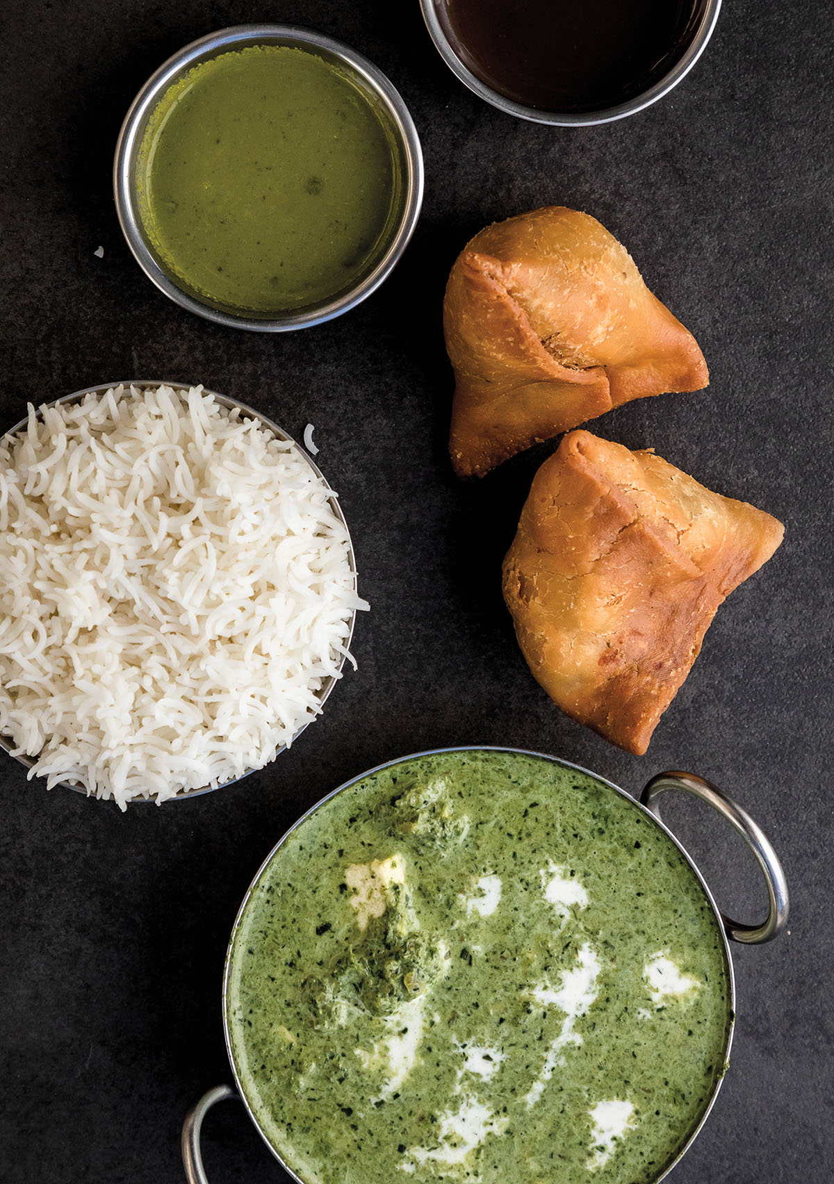 An overhead view of various Indian dishes