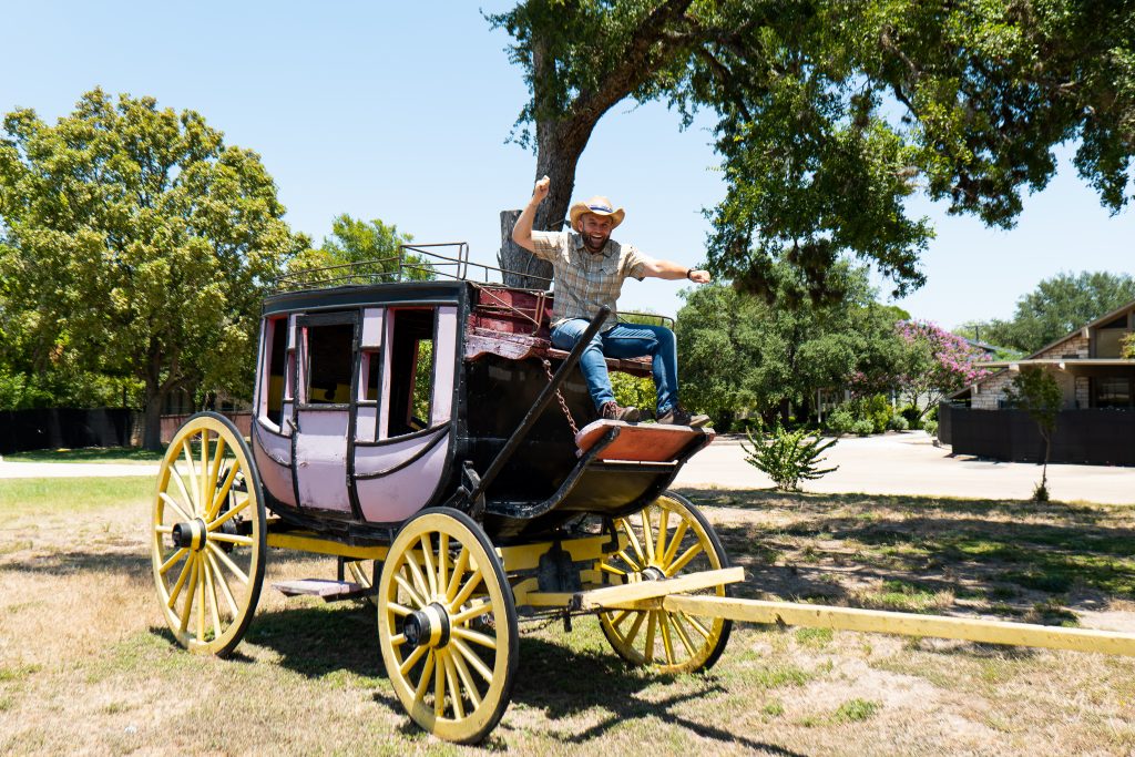 Chet Garner sits atop a stagecoach in Salado.