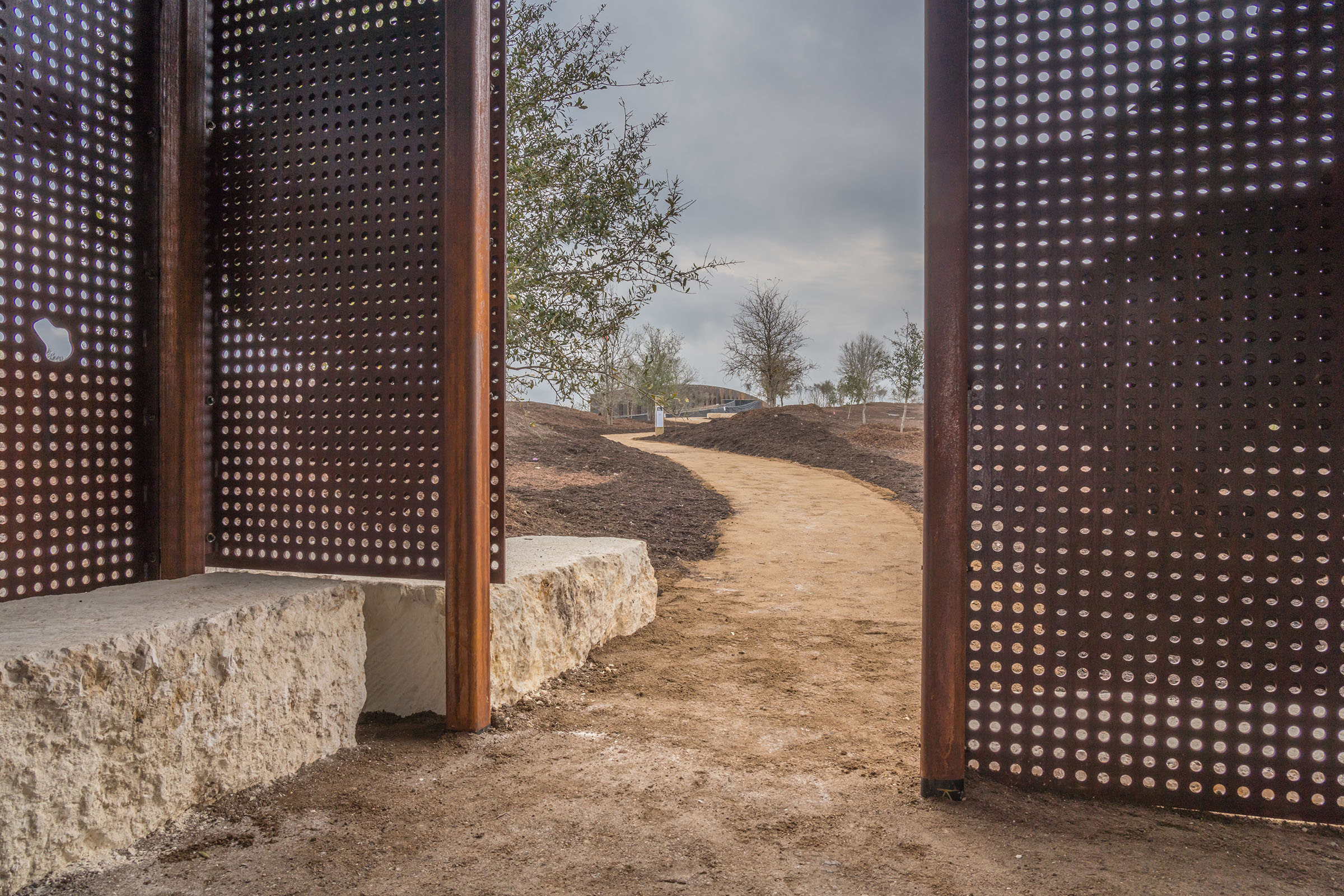 A view of the land bridge from inside a metal and stone wildlife blind