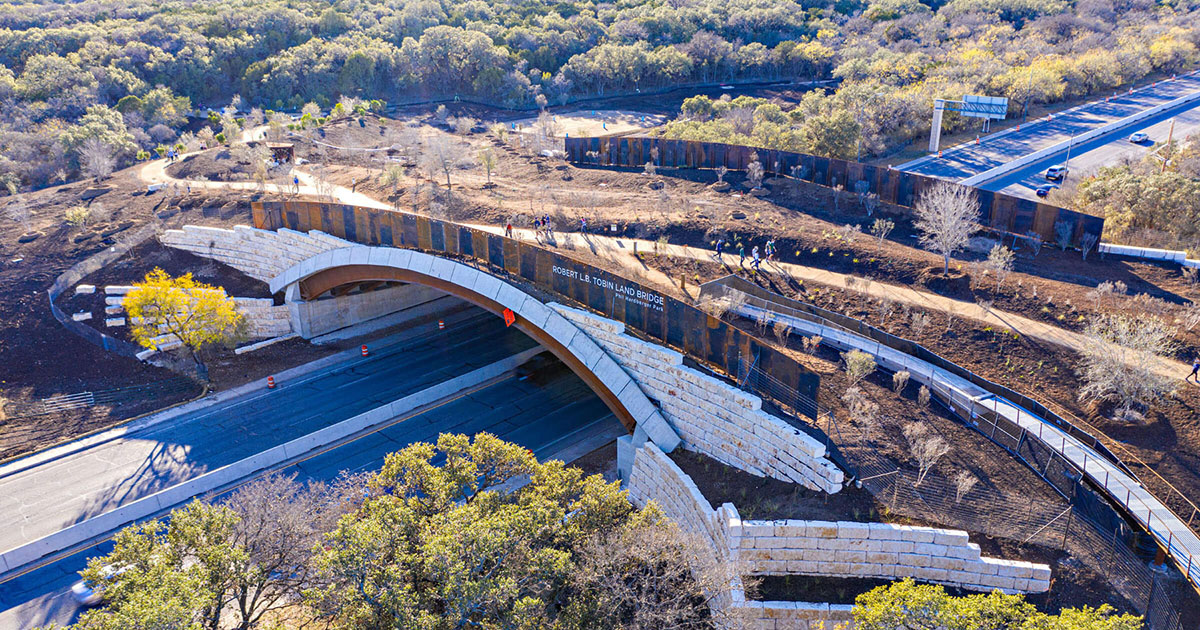 A photo of people walking across the new land bridge