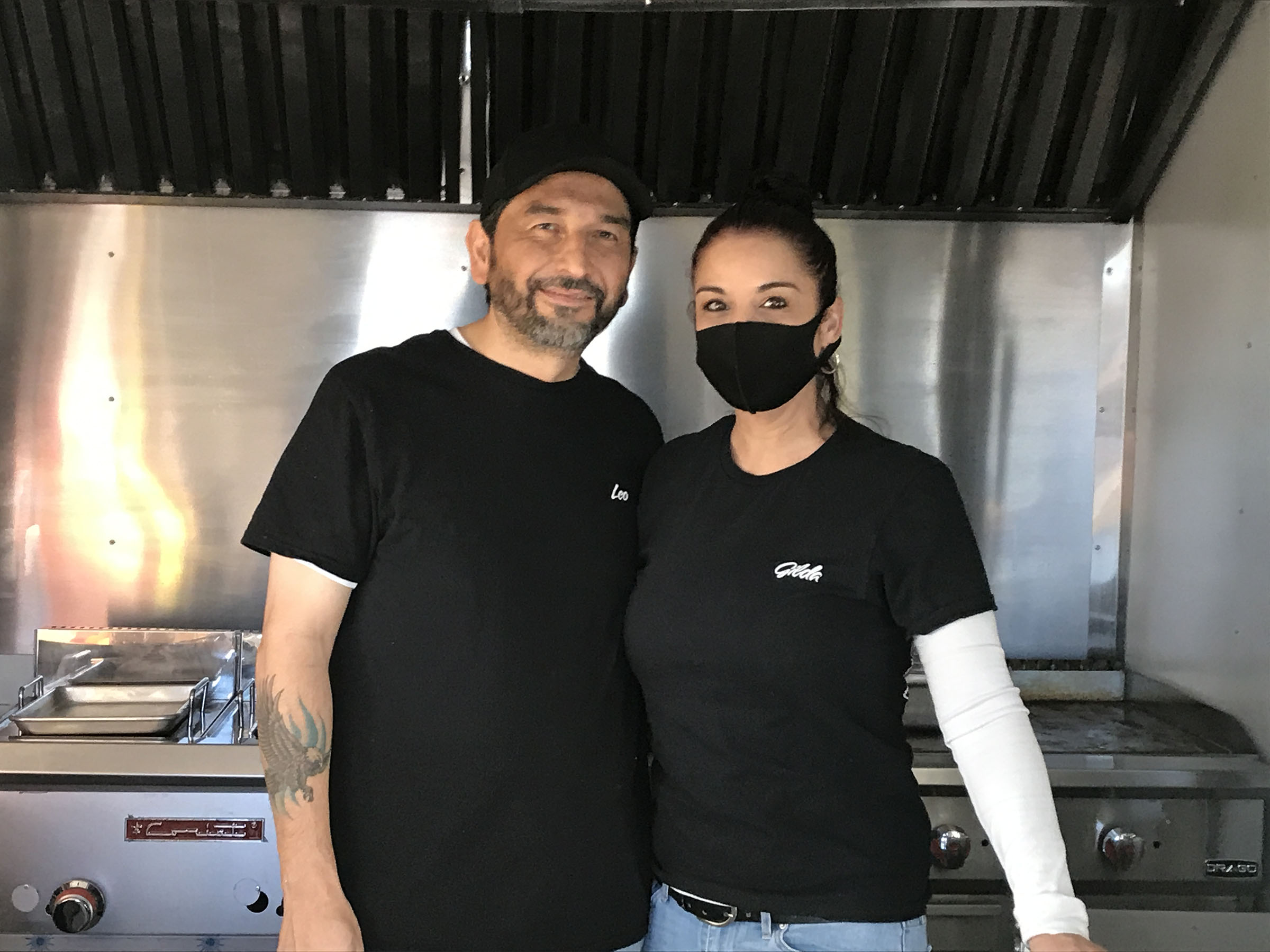 Leonardo and Gilda Jimenez, owners of Tacos Jimenez, stand in the kitchen of their food truck. Photo by Joe Nick Patoski.