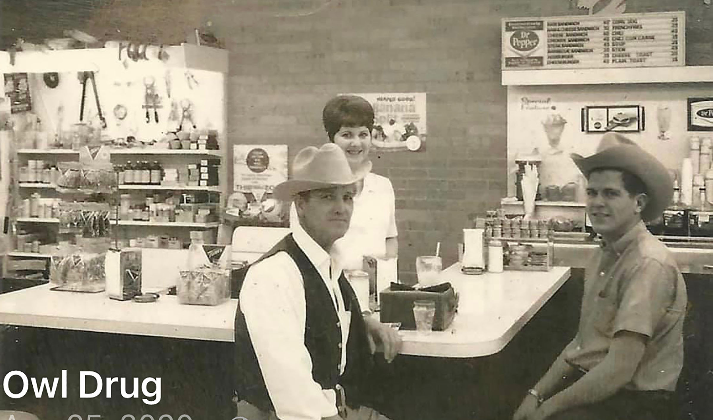 Mary Terry serves customers Ardell Smith and Dennis Dyerly circa 1966. Photo courtesy Owl Drug Store.