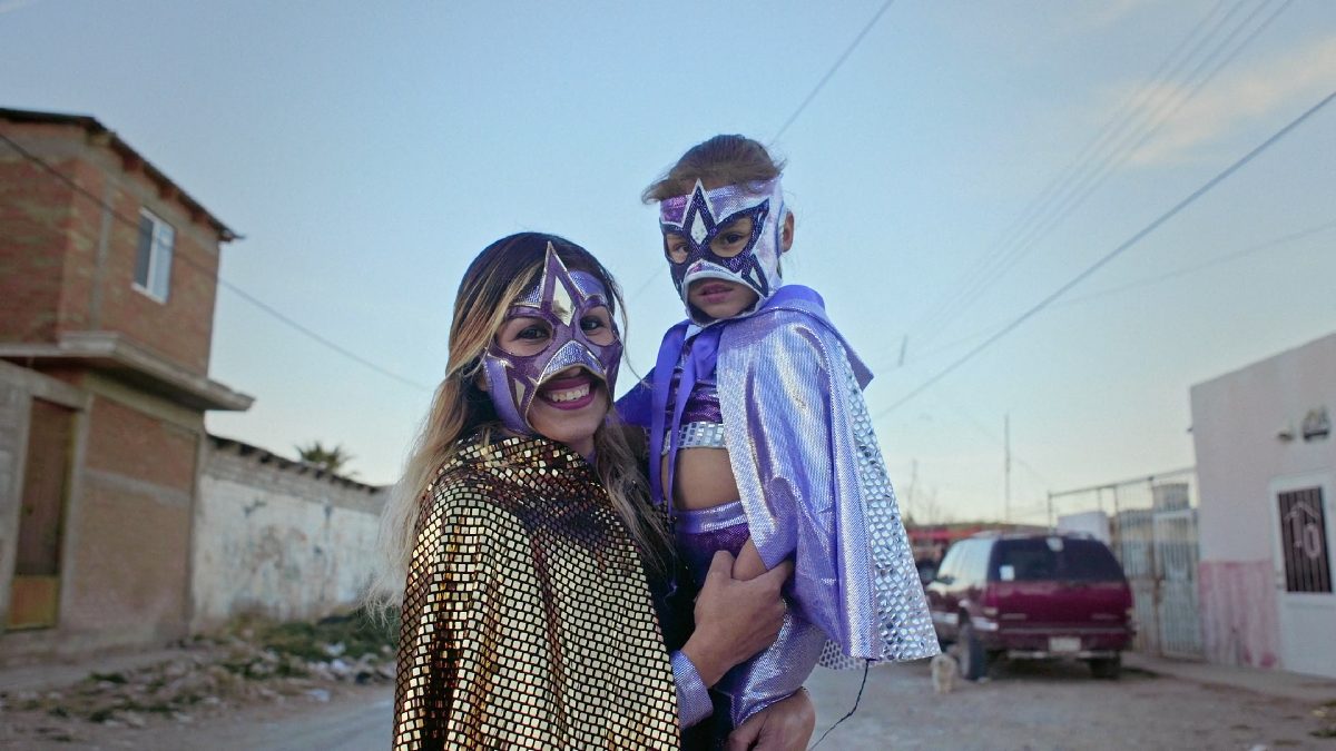 Color photograph of woman and child in masks