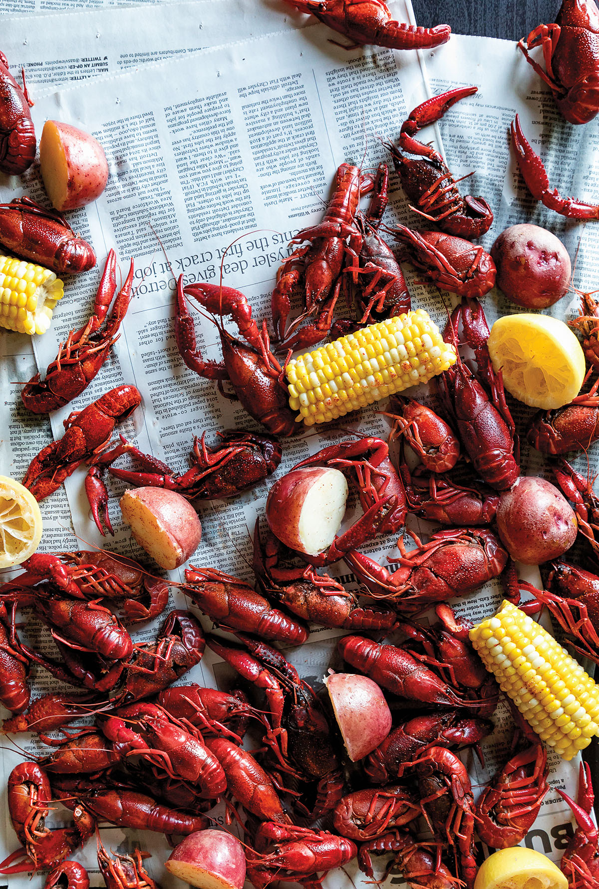 An overhead photo of crawfish, corn and potatoes on newspring