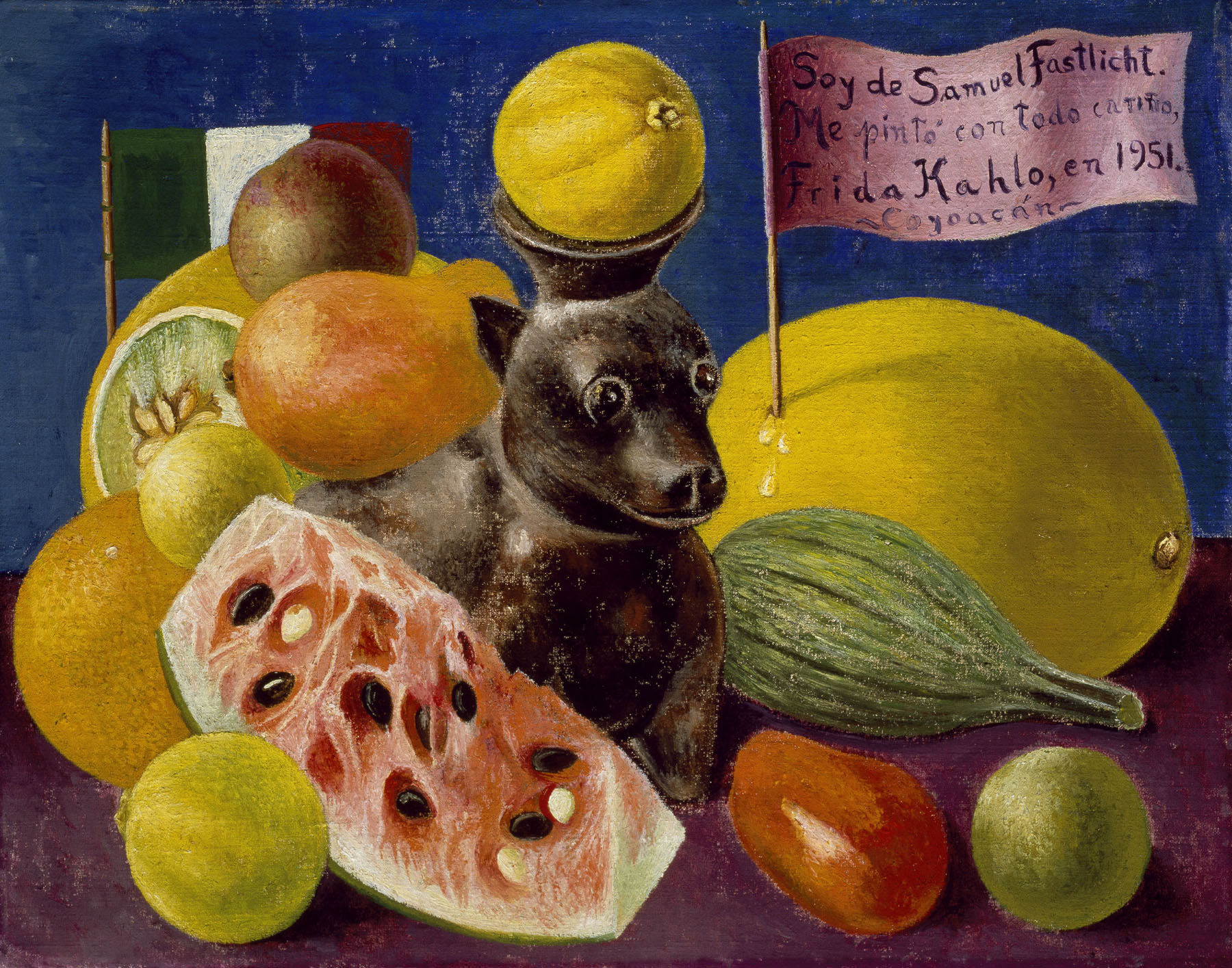 Frida Kahlo's "Still Life (detail), 1951," is an oil on masonite painting with fruit and a figurine of a black dog in the middle, with a flag sticking out of what looks like a yellow melon. Private Collection, Courtesy Galería Arvil. © 2021 Banco de México Diego Rivera Frida Kahlo Museums Trust, Mexico, D.F. / Artists Rights Society (ARS), New York 