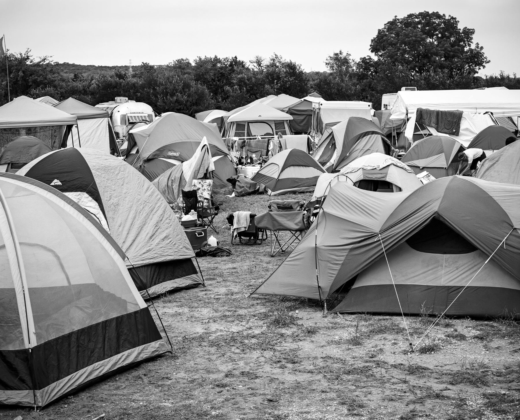 A black and white photo of a group of tents