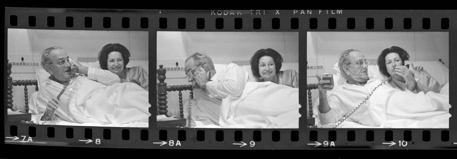Black and white photo of man and woman in bed