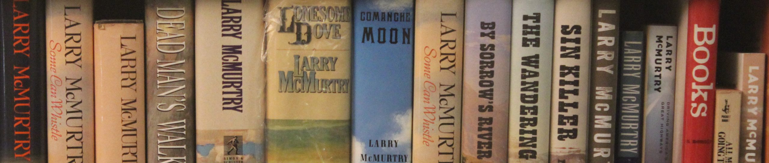 A collection of McMurtry books on a shelf