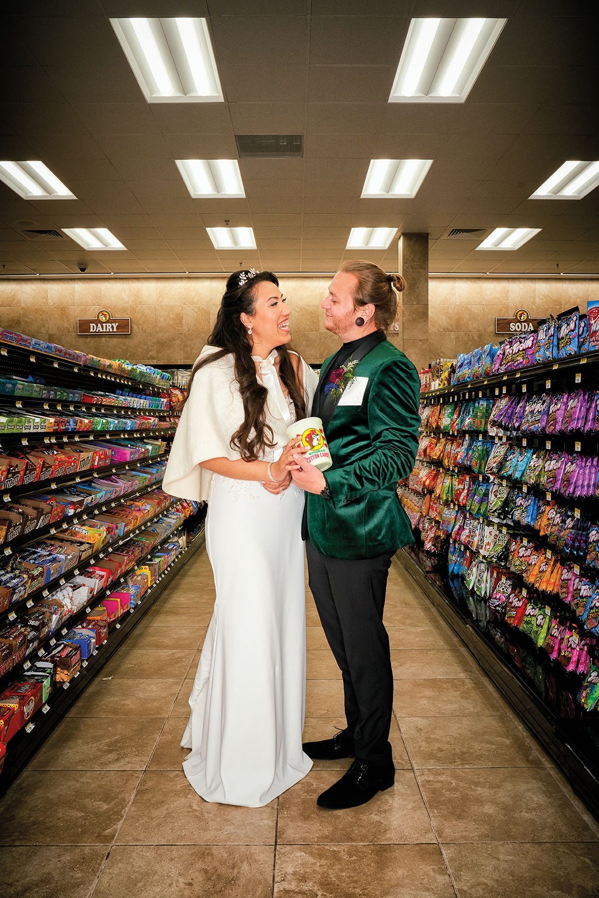 A married couple in the aisles of Buc-ees