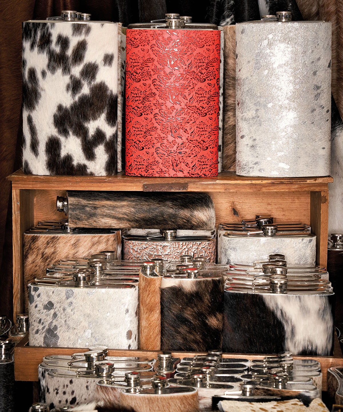 A collection of printed flasks on display at Buc-ees