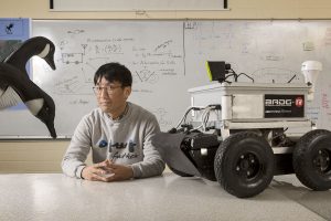 Dr. Hoo Kim is an engineering professor at LeTourneau University. He and his students created this robot to scare geese off golf courses. The formula is written on the whiteboard behind him.
