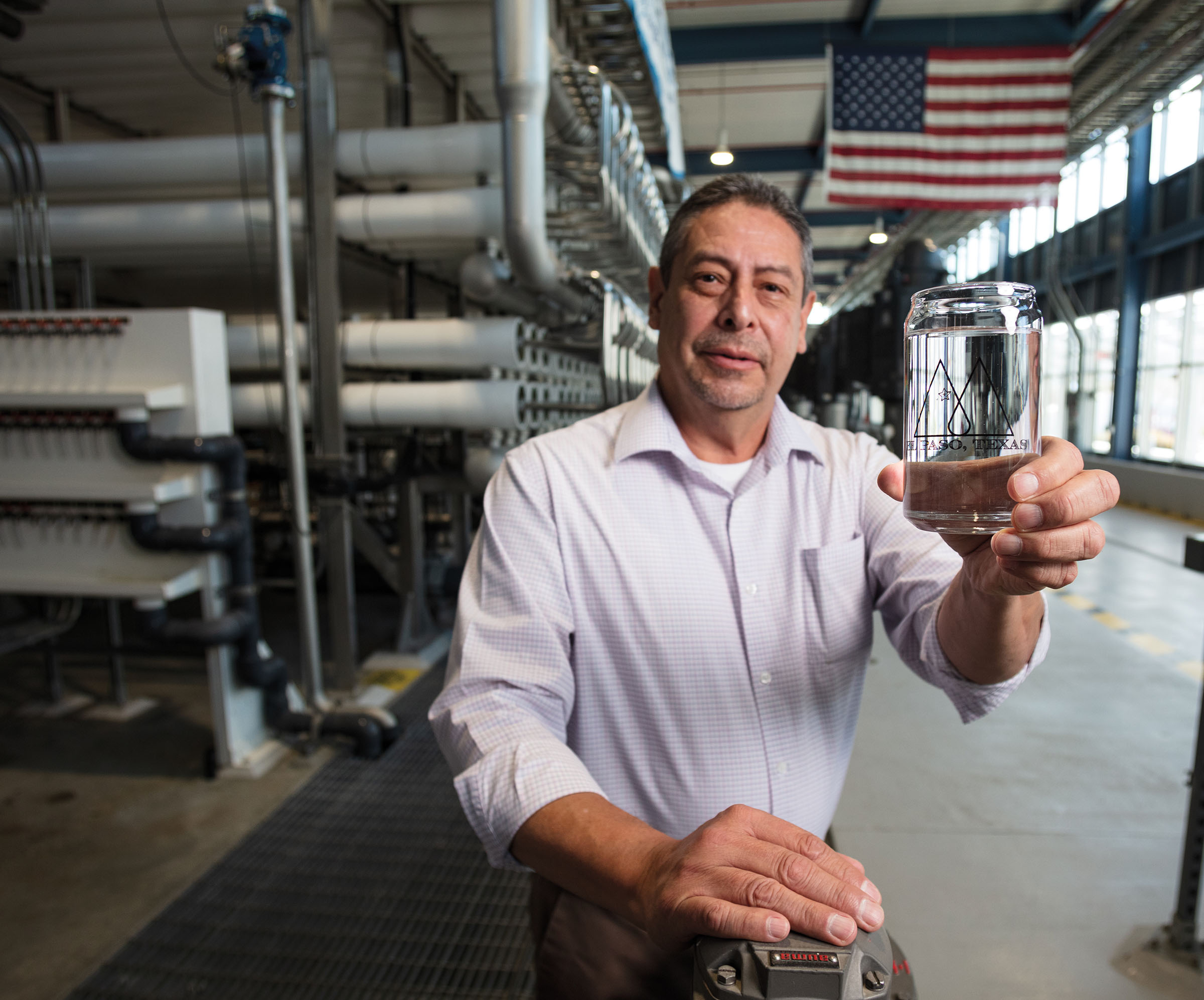 Art Ruiz Desalination Plant Superintendent holds a glass of Drinking water from the Kay Bailey Hutchison Desalination Plant in El Paso, TX