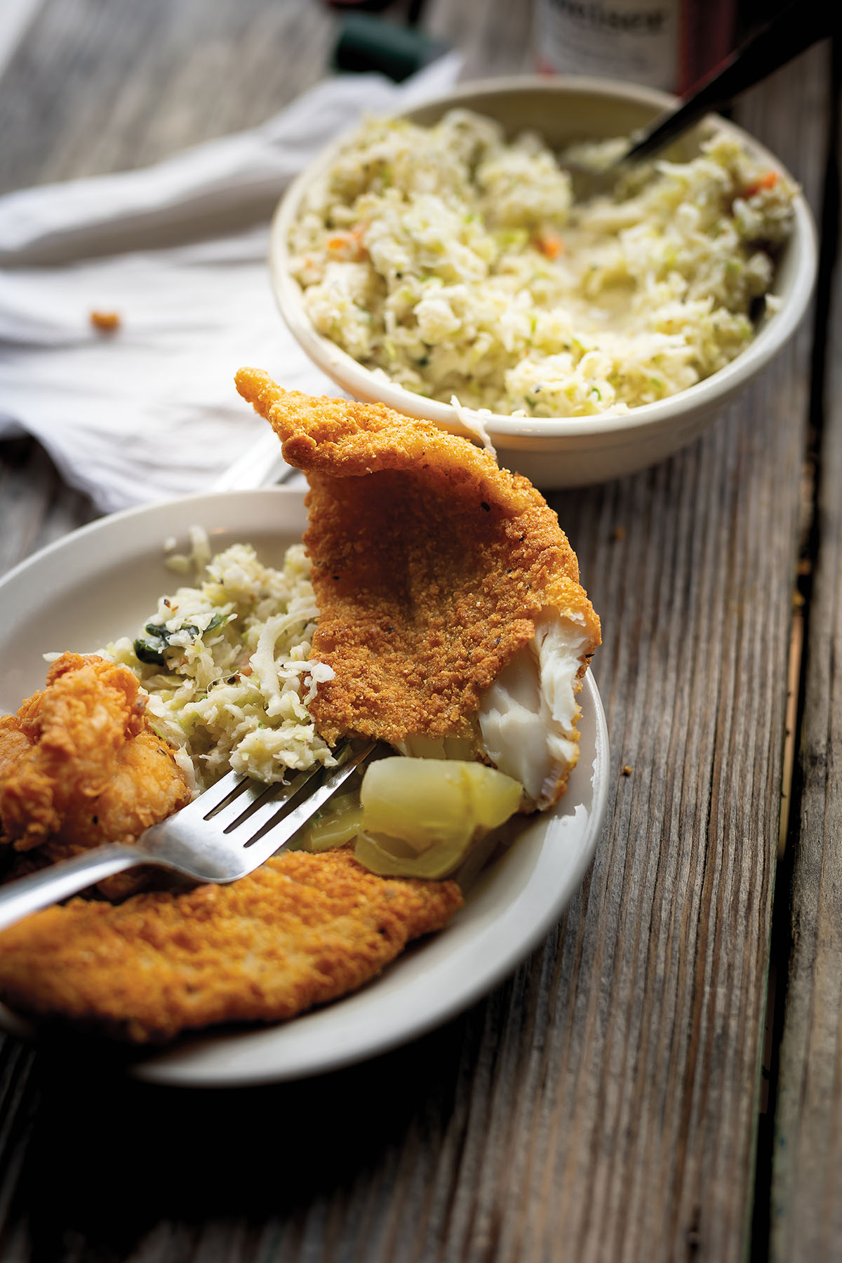 Photo of a fried catfish platter with coleslaw