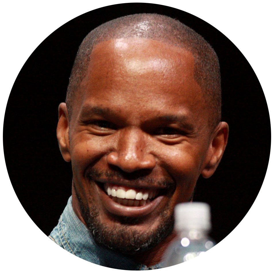 A picture of Jamie Foxx smiling in a denim shirt
