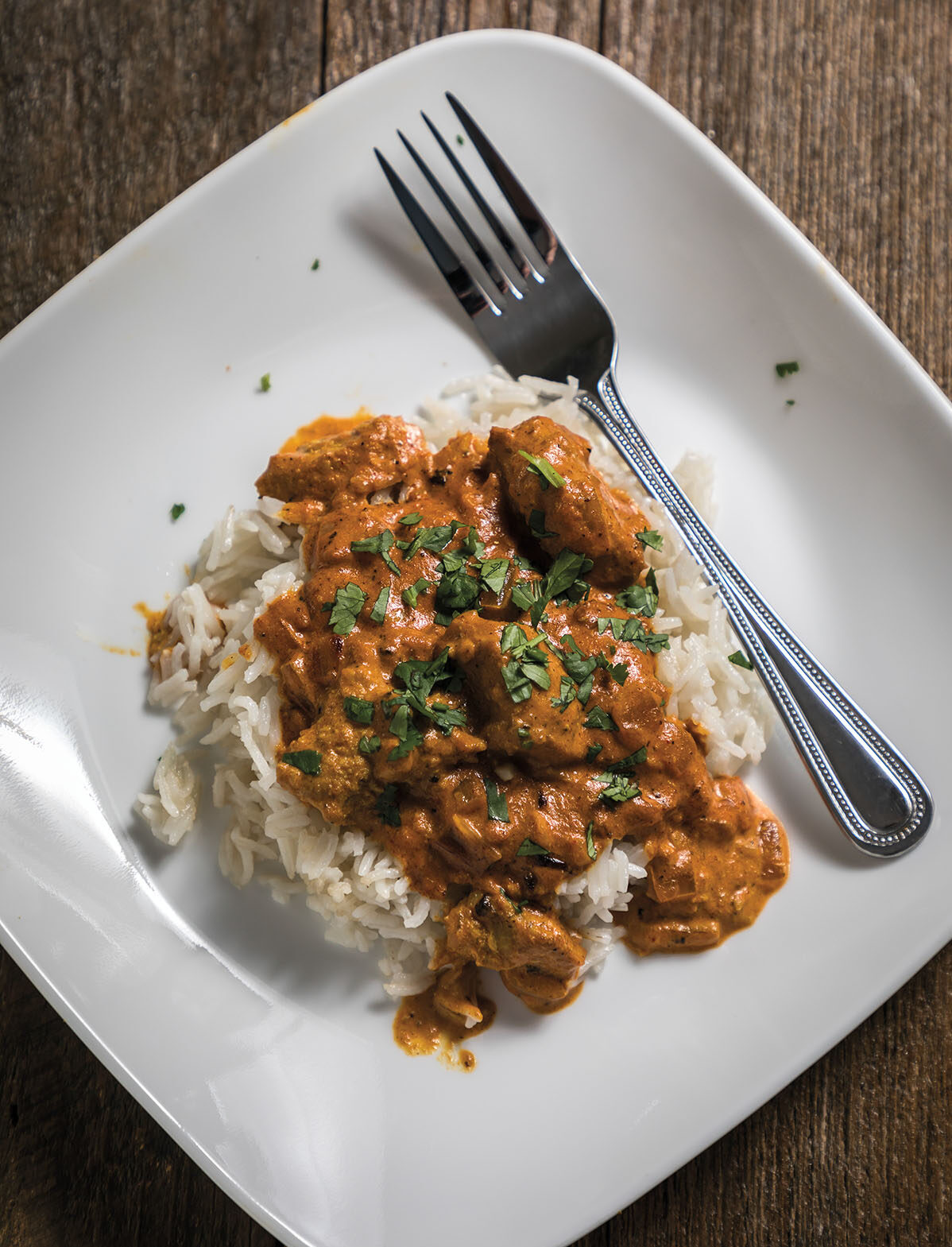 alligator tiki masala over a bed of rice