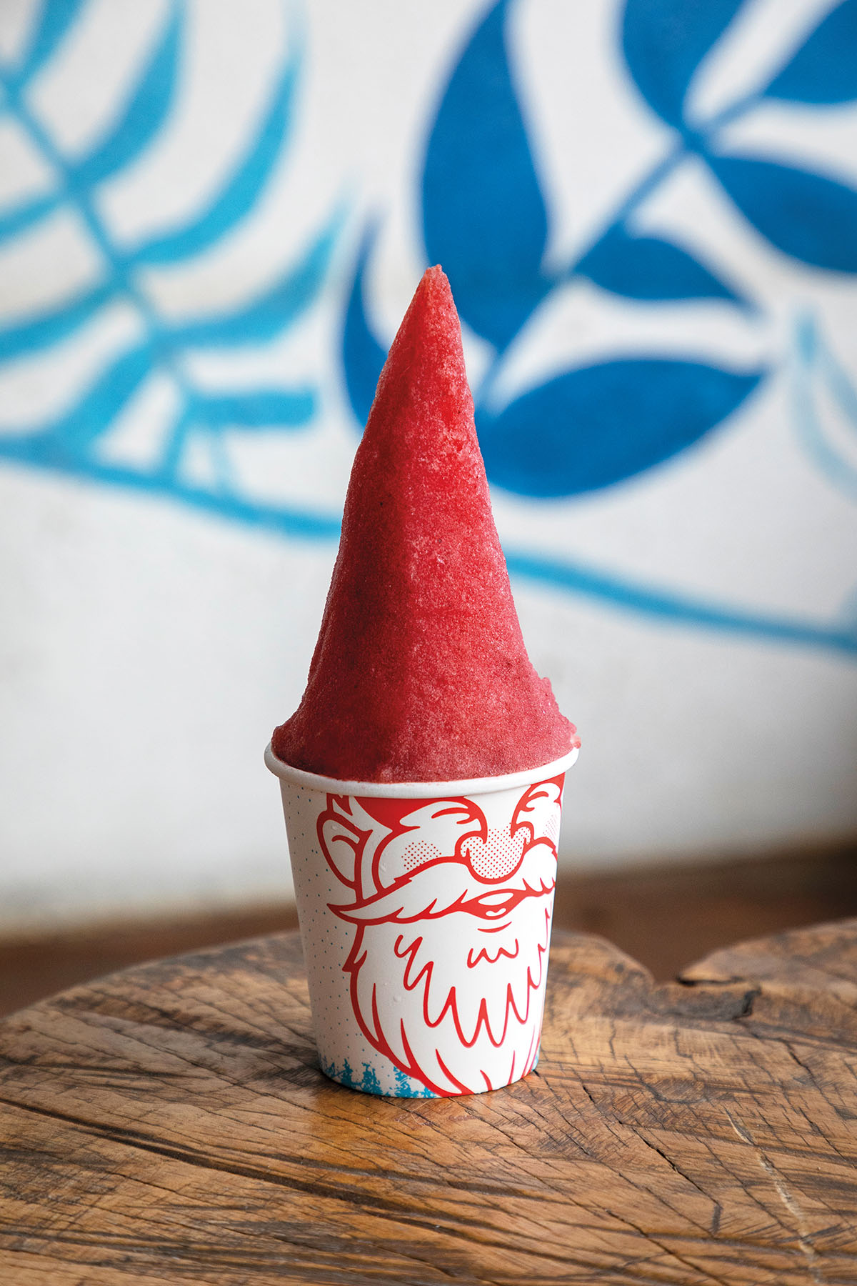 A red gnome shaped snow cone.