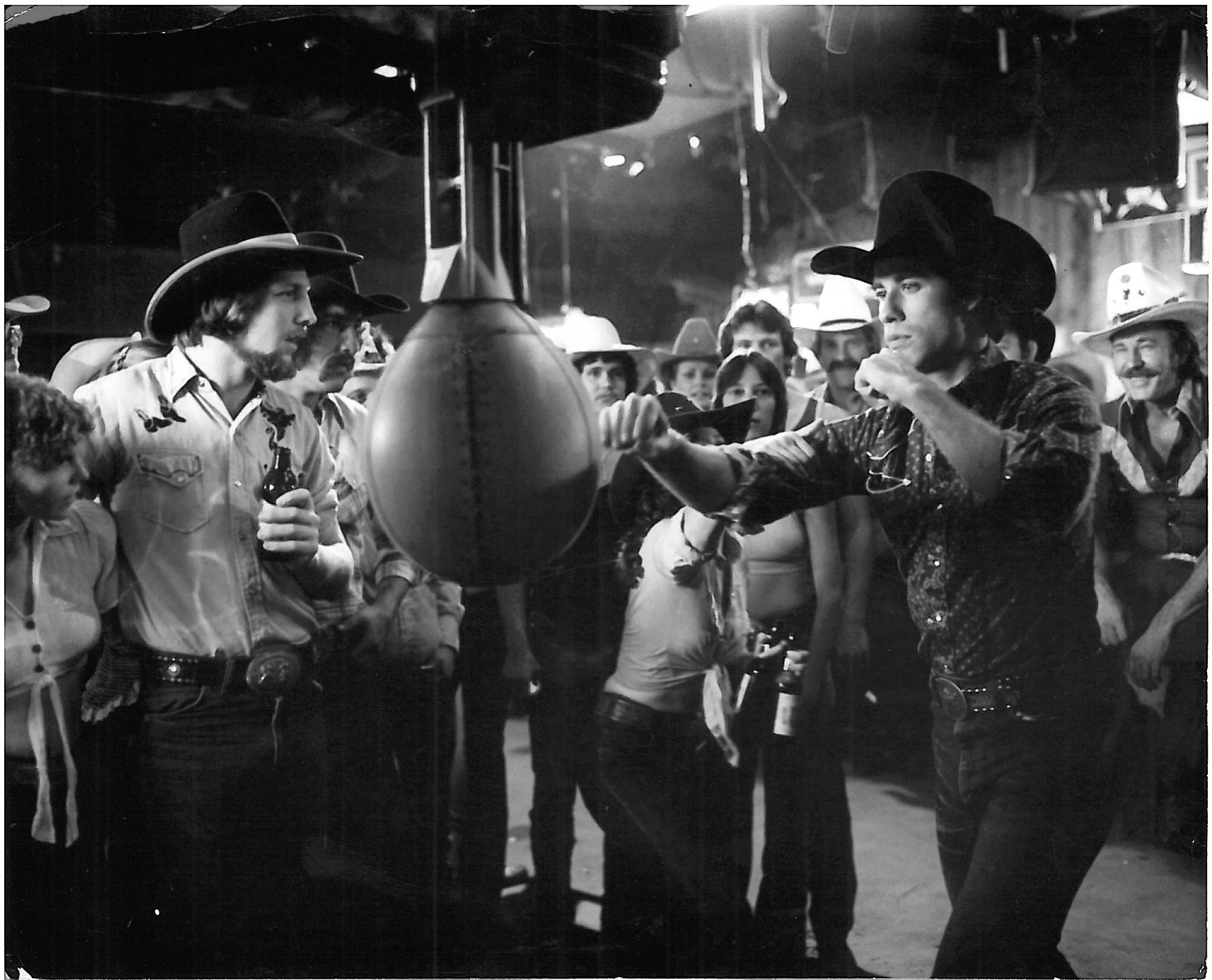 john travolta in urban cowboy punching bag in cowboy bar