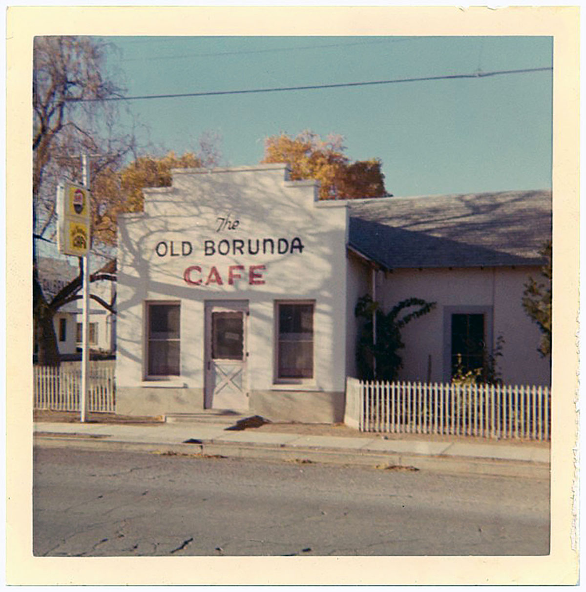 The outside of an adobe building reading 'The Old Borunda Cafe'