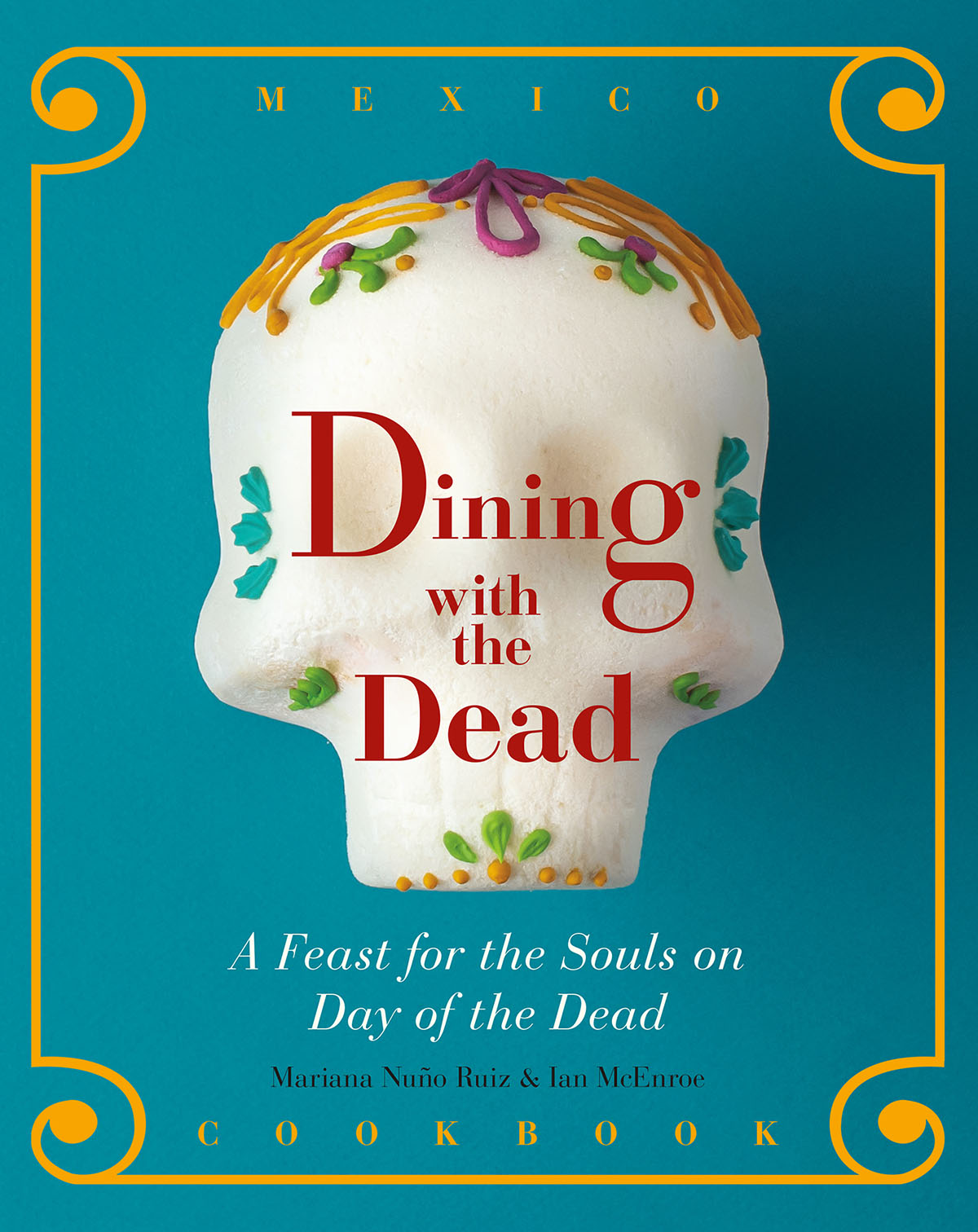The cover of a teal book with gold border and a sugar skull with red type reading "Dining with the Dead"
