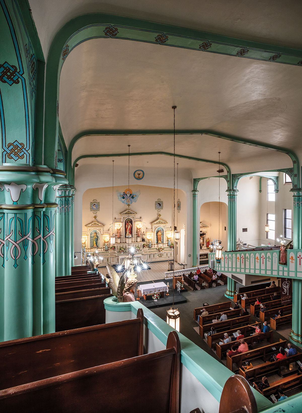 A light green interior with rich wood pews