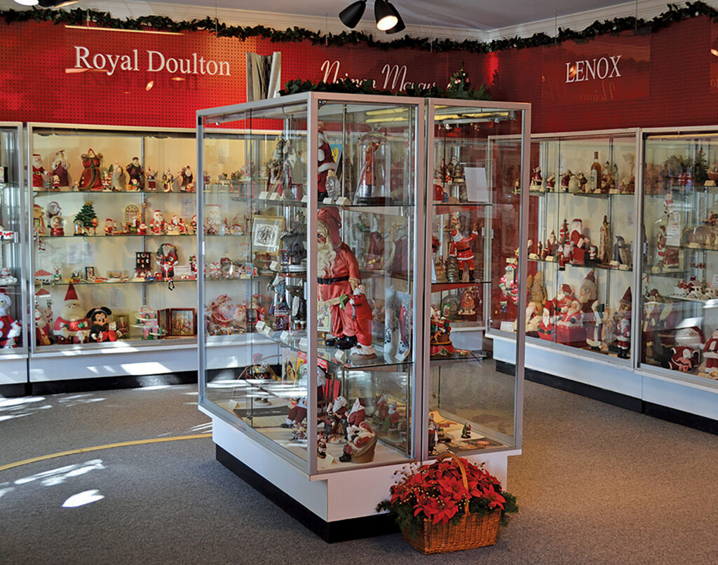 Display cases hold dozens of different Santa Claus figurines at the Santa Claus Museum. 