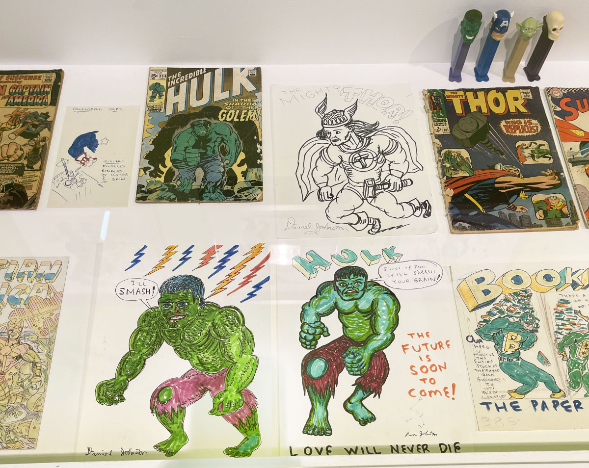 Drawings of superheroes and comic book covers