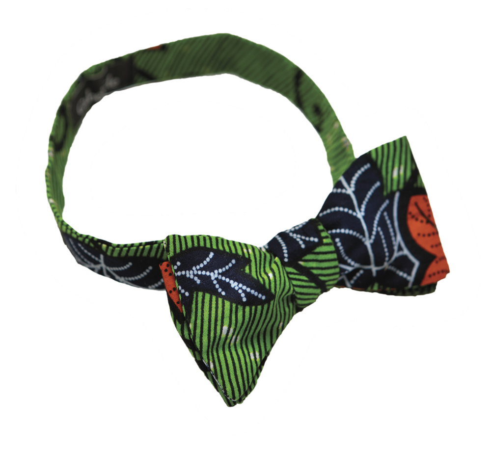 A green, black and red pet bow