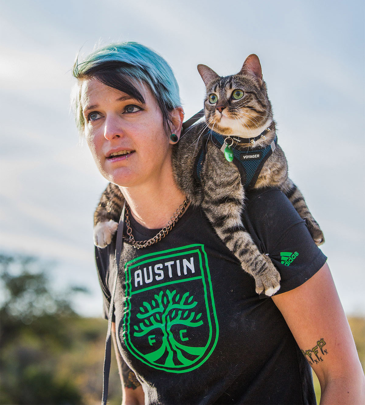 April Schupmann and her cat, Kiyomi, explore the trails at McKinney Falls State Park.