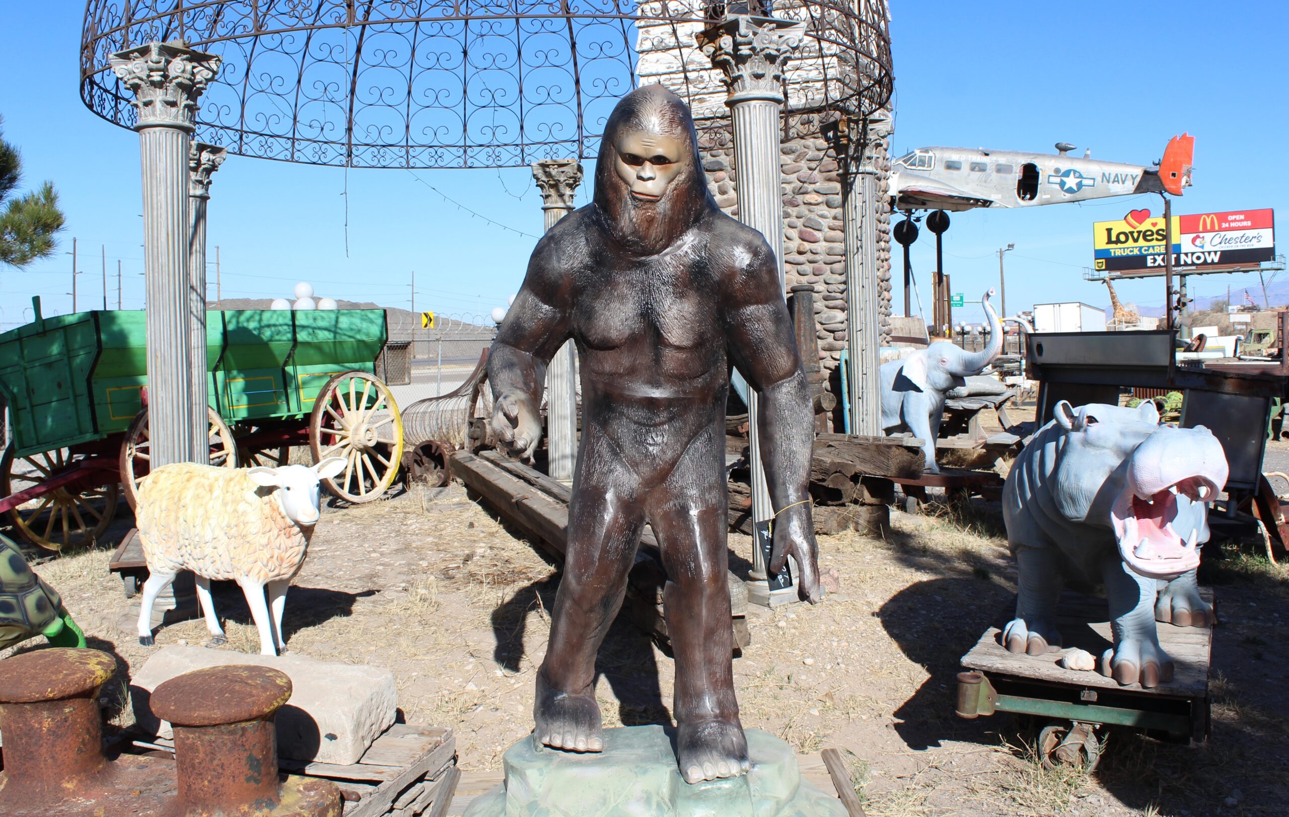 Color photo of lamb, hippo, elephant, and Bigfoot statues