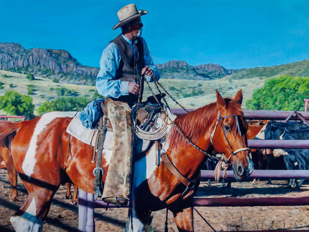 A painting of an older man in chaps and a hat on a brown and white spotted horse