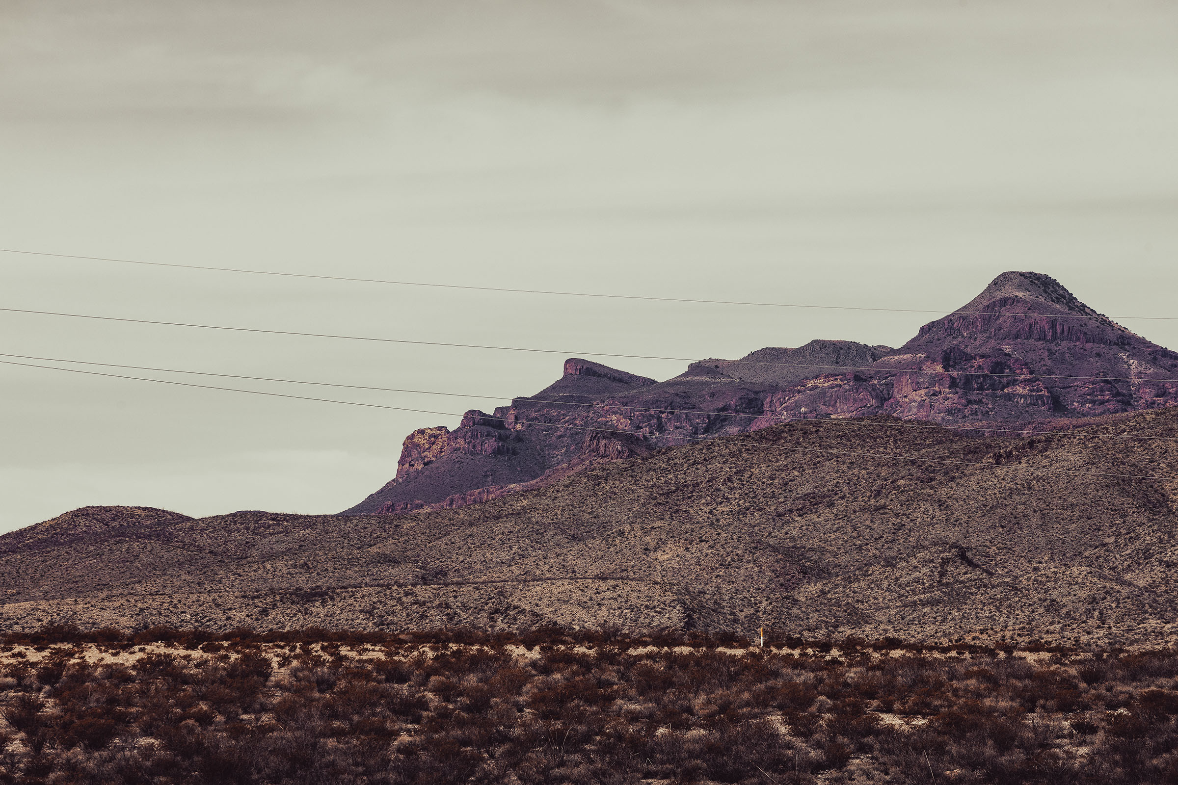 A mountain scene, in which the summit of the mountains resembles the facial structure of Abraham Lincoln