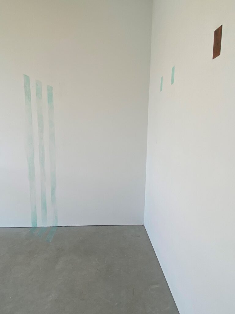 color photo of white walls with streaks of color